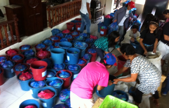 photo of relief supplies being packaged for distribution in Ilo ilo Philippines
